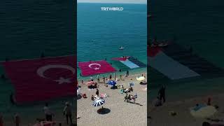 Divers unfurl Turkish and Palestinian flag in Antalya beach [upl. by Annekim]