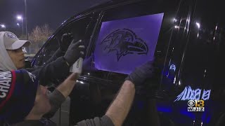 Fans get cars stenciled with Ravens logo ahead of playoff game [upl. by Eimarrej]