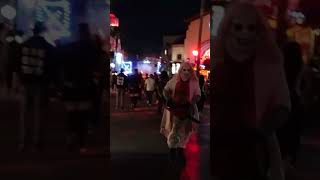 Universal Studios Halloween Horror Nights ChainsawWielding Scare Actors Unleashed in Scare Zone [upl. by Ateinotna882]