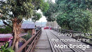 Thailand Holiday  Day 13  Giving alms to monks at Mon Bridge [upl. by Gader]