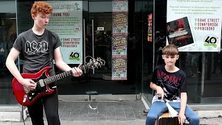 As ACDC Arrive in Dublin For a Concert Brothers Liam amp Adam Curran Perform One of Their Hits [upl. by Bocock]