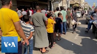 Palestinians Queue for Bread in Khan Younis as Food Runs Short  VOA News [upl. by Ahsirtal484]