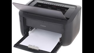 تشغيل الة الطباعة نوع كانون  how to configurate Canon printe first use [upl. by Suixela]