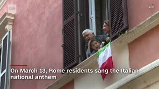 Under coronavirus lockdown Italians sing from balconies  CNN News [upl. by Artenra]