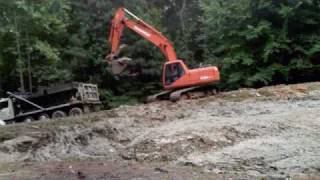 Excavators dredging a pond [upl. by Whitver281]