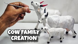 Sculpting clay Making Cow Family with clay  Clay Animals Art [upl. by Aicemak233]