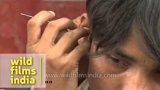 Cleaning ears with pins  It happens only in India [upl. by Carolin]