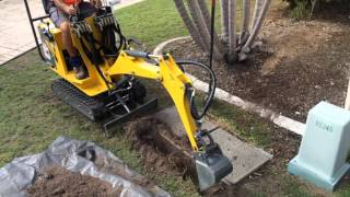 Ozziquip Mini Excavator Digging Out Telstra Pit NOTE THIS MODEL NOW SUPERSEDED [upl. by Yarrum]