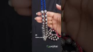 This exquisite neckpiece by Gumphan showcases reducing beads [upl. by Refitsirhc]