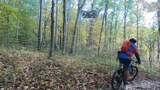 DJI Neo follows mountain biker through mountain bike trails on Follow mode set at “close” amp “flat” [upl. by Talia]