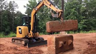 Myth Busters Cat® 305E2 Mini Excavator Lifting Demo [upl. by Nalniuq65]