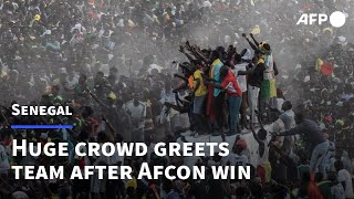 Ecstatic crowds greet victorious Senegal on Cup of Nations return  AFP [upl. by Arte62]