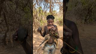 A Hadza hunter relishes a fresh and natural meal from the wild [upl. by Burrill483]