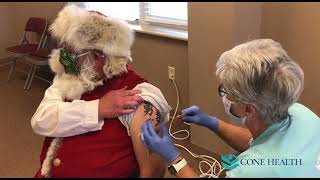 Santa Claus Gets COVID19 Booster at Cone Health Vaccination Site [upl. by Tirb469]