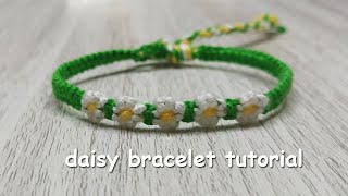 How to make yarn daisy bracelets 🌼 [upl. by Scheider]