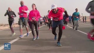 4000 runners participate in Pyramids Marathon in Egypt [upl. by Ettennahs]