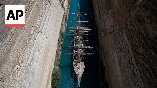 The Olympic flame crosses the Corinth canal en route to Marseille [upl. by Ledniahs]