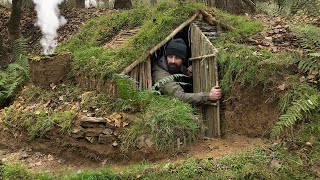 Building complete and warm survival shelter  Bushcraft earth hut grass roof amp fireplace with clay [upl. by Atilrak]