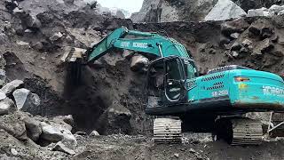 Large rocks collapsed as excavators dug into the sand cliffs [upl. by Gladwin]