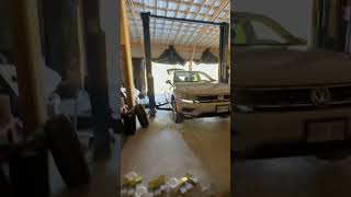 Changing wheels using 2 post lift inside garage [upl. by Maddox]