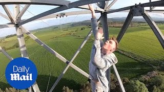 Reckless youths hang off electricity pylon in dangerous knife stunt [upl. by Carine469]