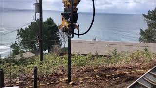 Excavator Driving Steel Piles at an Ocean Front Property  Vibe Drive MX PUMA vibrating pile driver [upl. by Assira]