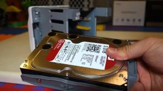 How to Setup Synology DS413j  Installing The Hard Drives [upl. by Nylekcaj914]