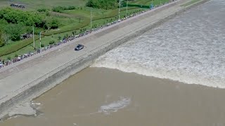 Spectacular Tidal Bore on Qiantang River Wows Viewers [upl. by Aserehtairam980]