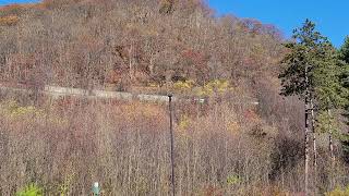 Horseshoe Curve NS 1164 amp 4059 lead a heavy eastbound loaded coal around the curve4 DPUs [upl. by Aicelef]