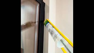 Black Silicone sealant to shower screen against a white wall mastic silicone [upl. by Reinhold2]