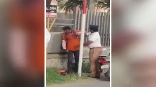 Swiggy delivery boy attacked by cop after he allegedly tried to stop a van that knocked down a woman [upl. by Aivekal]