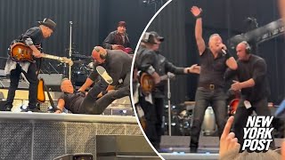 Bruce Springsteen falls on stage band rushes to help after wipeout  Page Six [upl. by Hugon420]