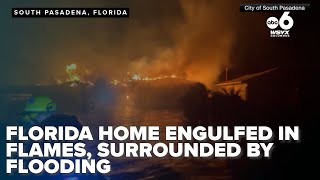 Home in Florida engulfed in flames surrounded by flood water during Hurricane Helene [upl. by Nelleh]