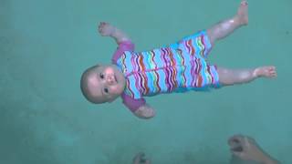 Baby swimming  floating unassisted at 5 months old [upl. by Enelyak993]