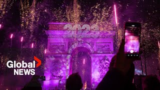 New Years 2023 Paris France gets the party started with fireworks smoke show over Arc de Triomphe [upl. by Piderit]