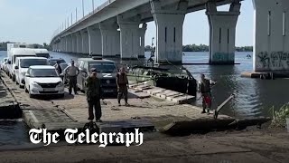 Russians build river pontoon after Ukraine shelling of strategic bridge in Kherson [upl. by Ytsirk]