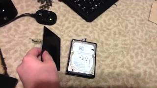 Taking apart an xbox 360 slim hard drive [upl. by Yonatan]