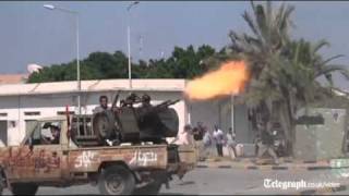 Libya conflict rebels fight their way into Col Gaddafis compound [upl. by Aneetsyrk]