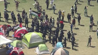 Police in riot gear blocks Denver students from returning to their encampment at Auraria campus [upl. by Ahsinroc485]