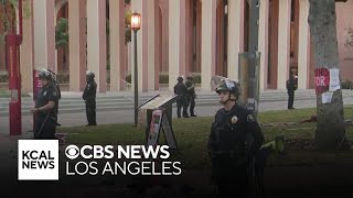 LAPD officers in riot gear clear proPalestine encampment at USC [upl. by Enirehtac]