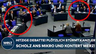 BUNDESTAG Hitzige Debatte Plötzlich stürmt Kanzler Olaf Scholz zum Mikro  und kontert Merz [upl. by Meras272]