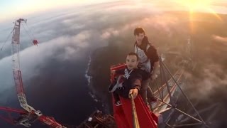 Daredevils climb crane take selfie nearly 1200 feet up [upl. by Haily]