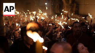 Eastern Orthodox worshippers throng Holy Fire ceremony in Jerusalem [upl. by Aivilys]