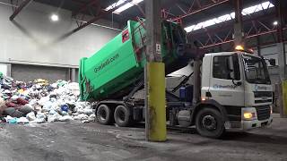 Emptying Gradeall Hook Lift Portable Waste Compactor [upl. by Etnoj40]