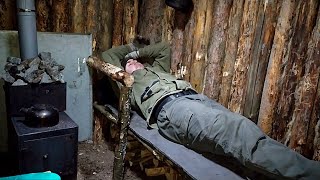 Building a wooden bed in a hut in the middle of winter and snow  Free survival in the forest [upl. by Auoz]