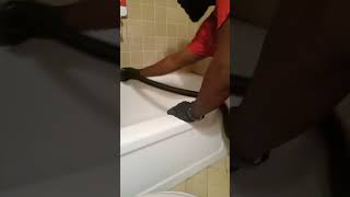 DAP IT OUT Some call it CAULKING Removing old dap from a tub plumbing bathtub diy [upl. by Akerahs]