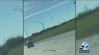 Video shows debris falling onto highway after 2 aircraft crash midair during Dallas WWII airshow [upl. by Ailehs626]