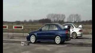 Mitsubishi Evolution VI 6 vs Subaru Impreza 14 mile race [upl. by Gwenny104]