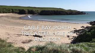 Cable bay sandy beach Porth Trecastell Isle of Anglesey is on the Anglesey Coastal Path [upl. by Lindahl]