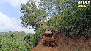 The gruesome job of a bulldozer operator working on a plantation road on a very high hill [upl. by Nomihs]